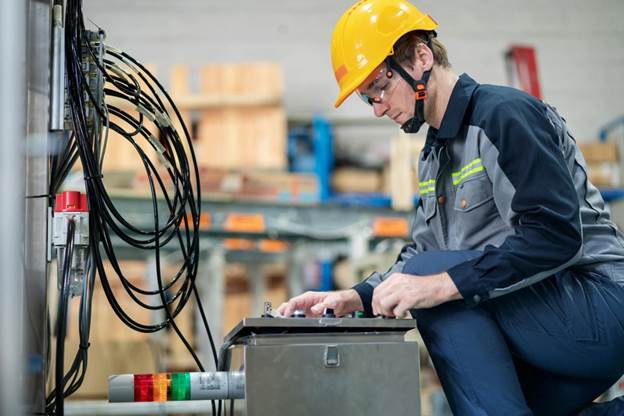 Engineer reviewing wiring harness design specifications